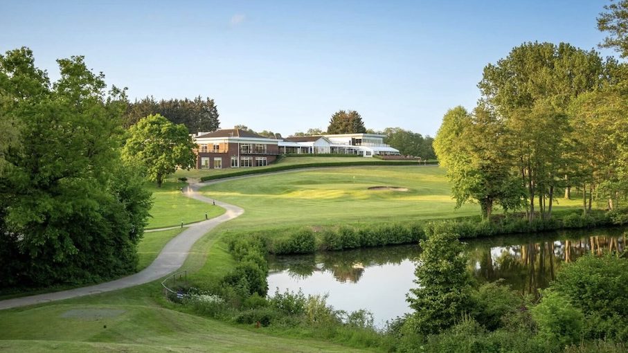 Stoke by Nayland Golf Club, Essex - Club House and Green with lake surrounded by trees