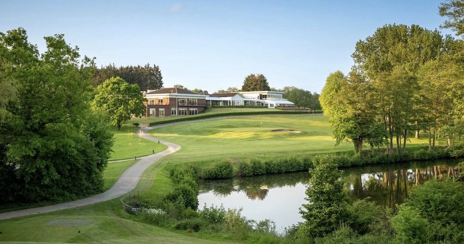 Stoke by Nayland Golf Club, Essex - Club House and Green with lake surrounded by trees