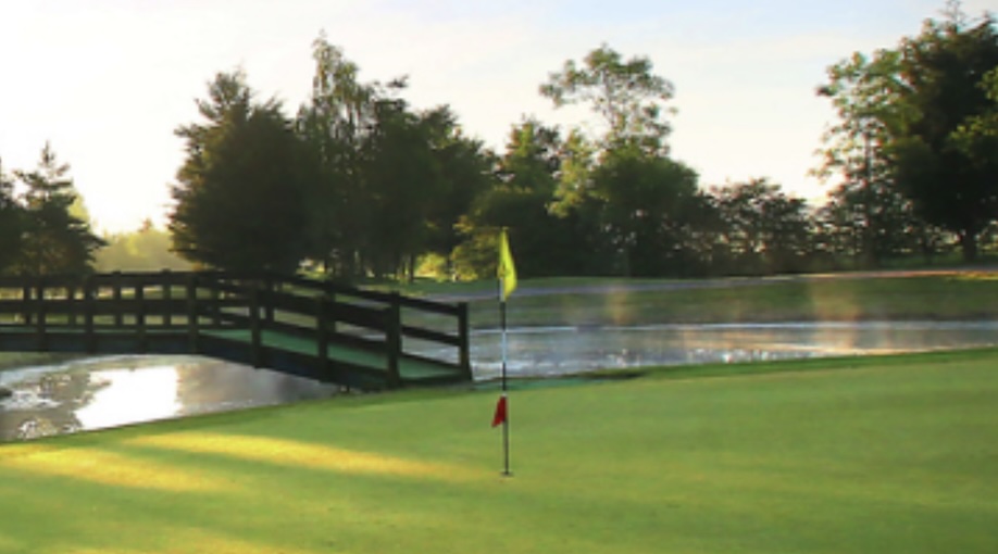 Golf Club England - Dunston Hall Golf Club, Norfolk,UK - Golf Vouchers Dunston Hall Golf Club, Norfolk, - view of golf course green and water feature with trees lining the backdrop