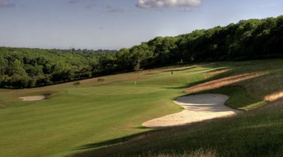 Farleigh Golf Club, Surrey, - View of golf course from fairway looking up to green with large bunker and trees lining the background