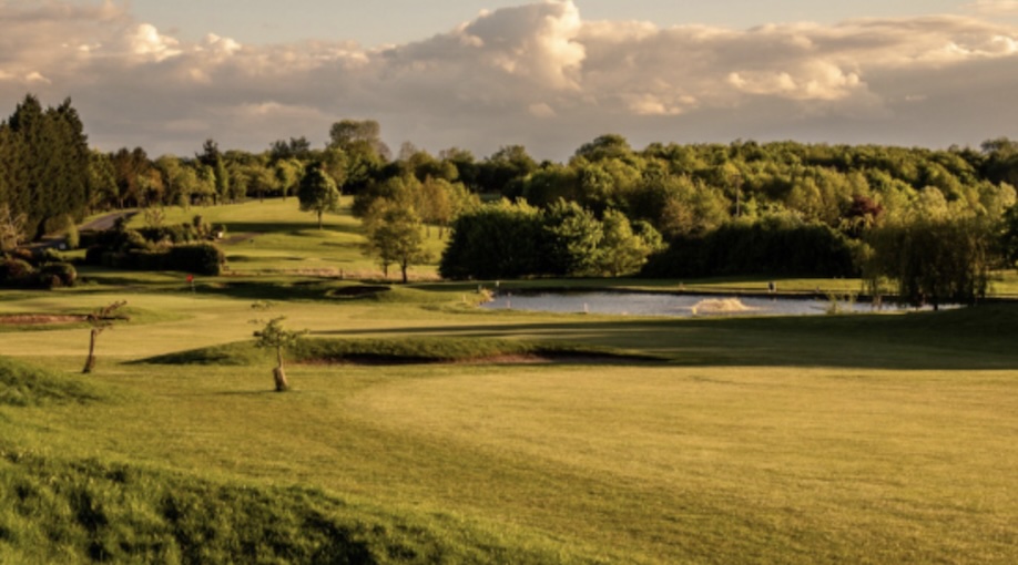 Gaudet Luce Golf & Leisure Complex, Worcestershire, - view of golf course fairways and greens, with large pond water feature and wooded areas