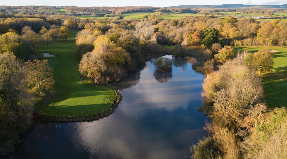 Marriott St Pierre Hotel & Country Club, Monmouthshire - Aerial view of golf course with lake lake central to fairways and greens around