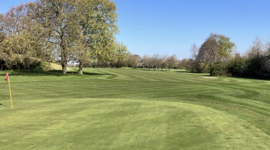 Oaks Sports Centre Golf Club, Surrey,- view of golf course on green looking back to fairway and tee