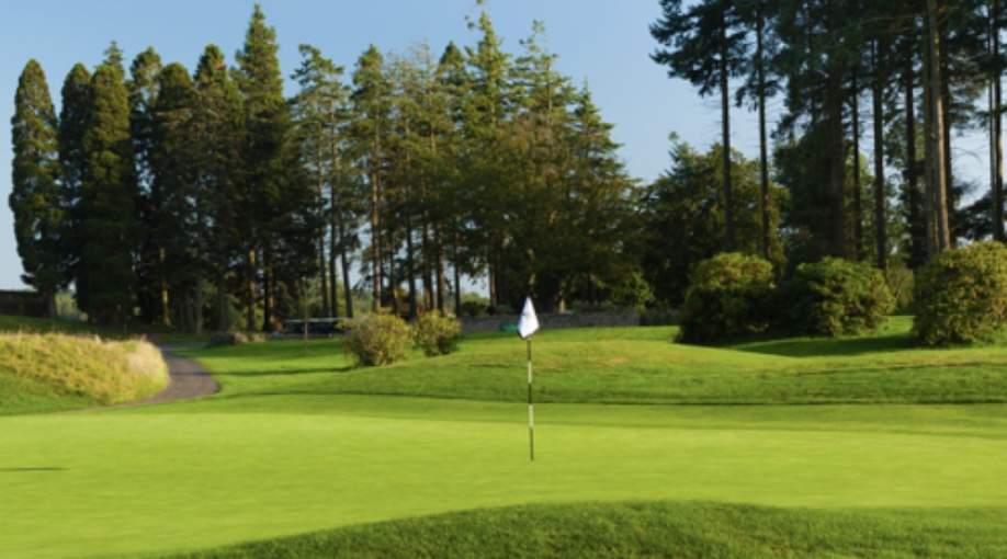 Slaley Hall Golf & Country Club, Northumberland - View across golf course green to fairway and trees