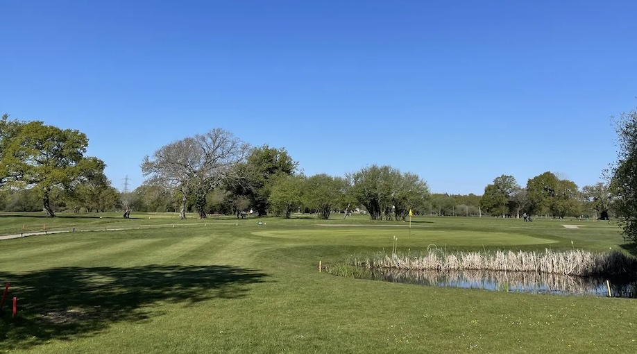 Golf Club England - Tickenham Golf Centre, Somerset,UK - Golf Vouchers Tickenham Golf Centre, Somerset, - view of golf course next to pond and green looking at trees beyond