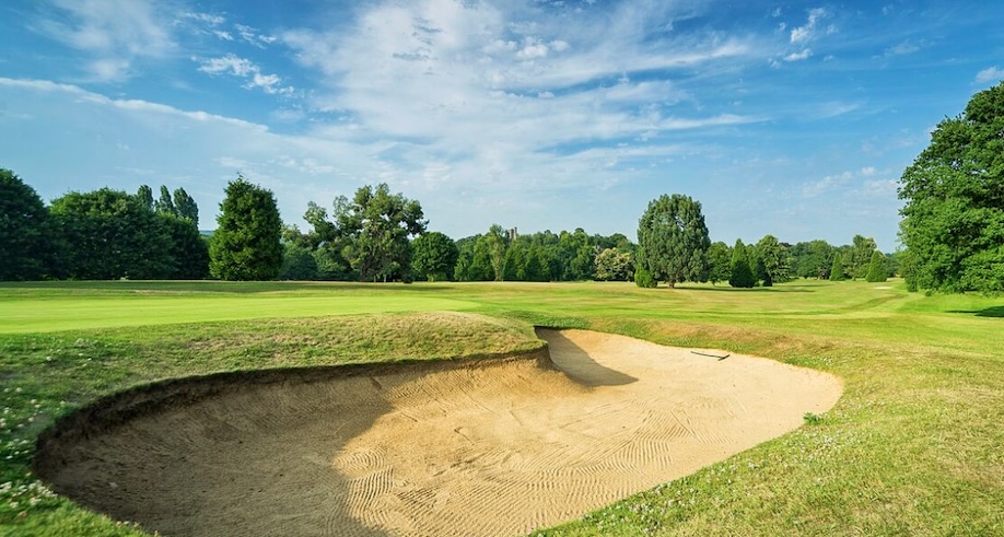 Golf Club England - West Malling Golf Club, Kent, UK - Golf Vouchers West Malling Golf Club, Kent - view of golf course green and fairway with large bunker and trees in distance