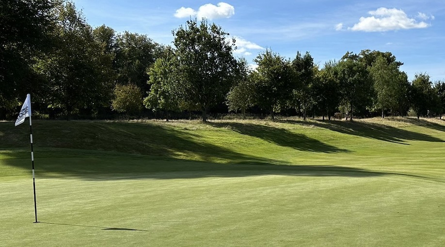 Donnington Grove Golf Club, Berkshire - View from golf course green over to tree lined fairway